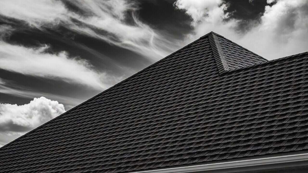 Roofers working on a residential roof.
